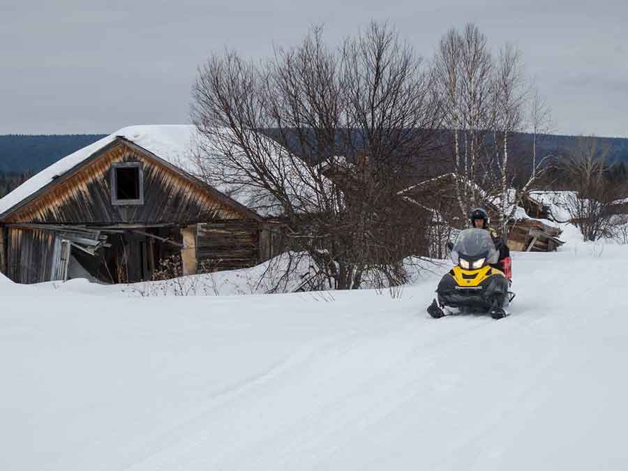 Snowmobile ghost town Ural District of Russia