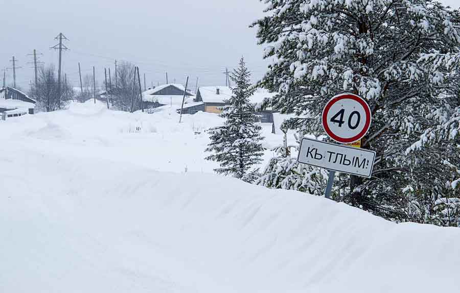 Snowmobile through the Russian village of Kytlym which was closed to outsiders during Soviet rule.