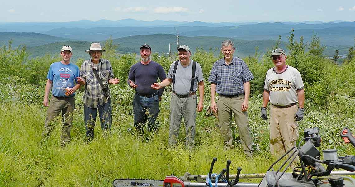 Snowmobile Volunteers work on NH trails