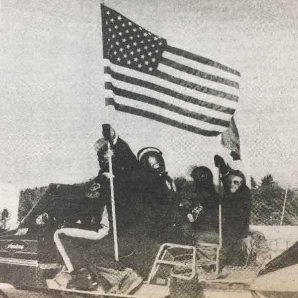 NH snowmobile historic photos with flag