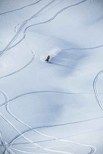 Snowmobilers ride mountains in Denali Mountain Range