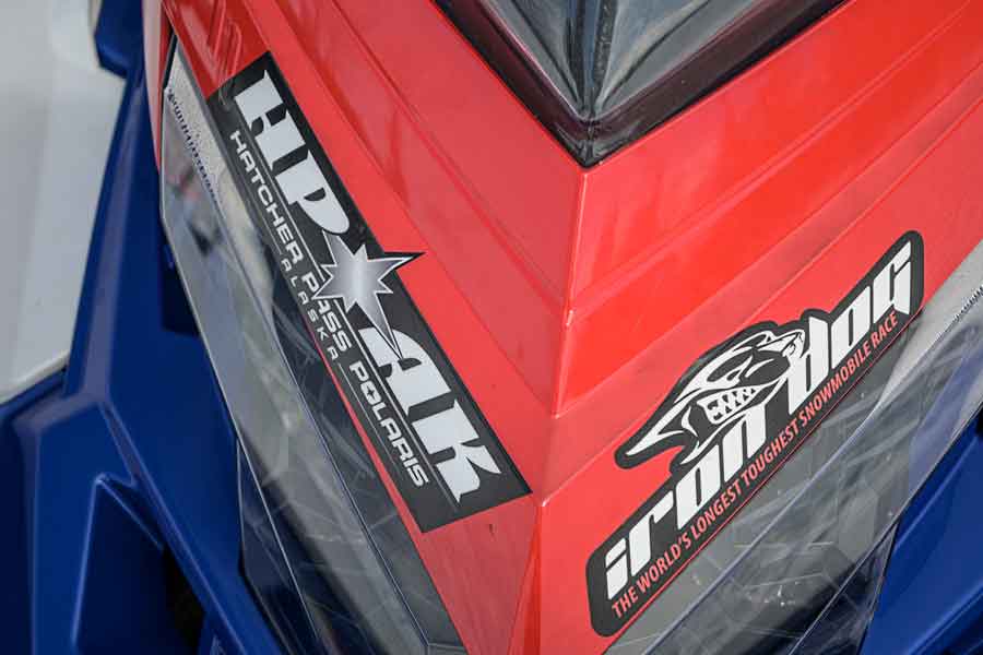 Several sleds we rode had competed in the Alaska Iron Dog snowmobile race and wore decals.