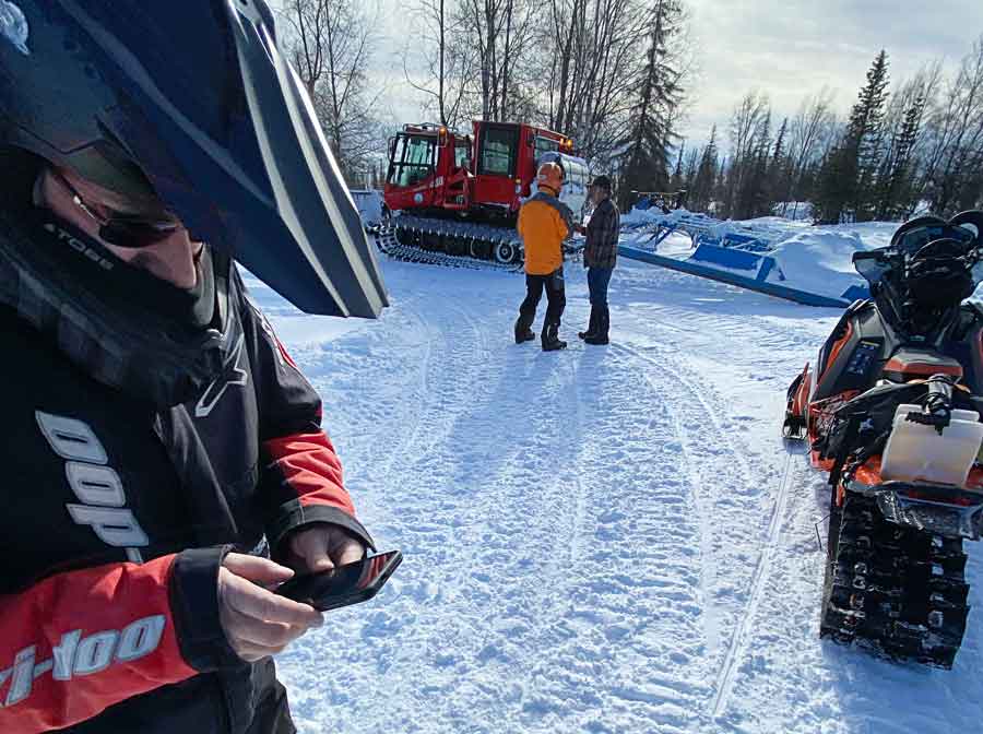 Group at bon fire at Gate Creek Cabins in Petersville Alaska