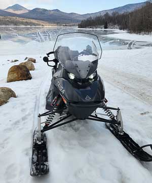 Front of Taiga electric snowmobile in Vermont