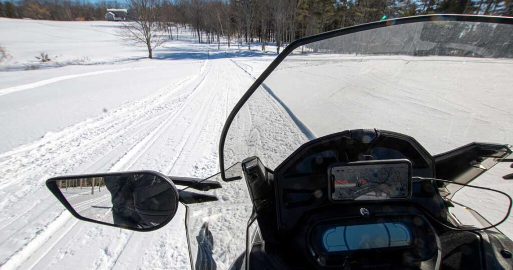 View of trail from snowmobile seat in NH.