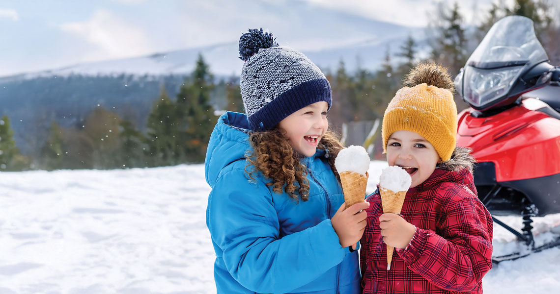 Children eating the ultimate redneck ice cream recipe a hilarious sweet treat. It is made from snow.